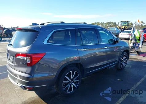 2022 Honda Pilot 2Wd Touring 7 Passenger z USA, uszkodzony, nr VIN 5FNYF5H67NB011450